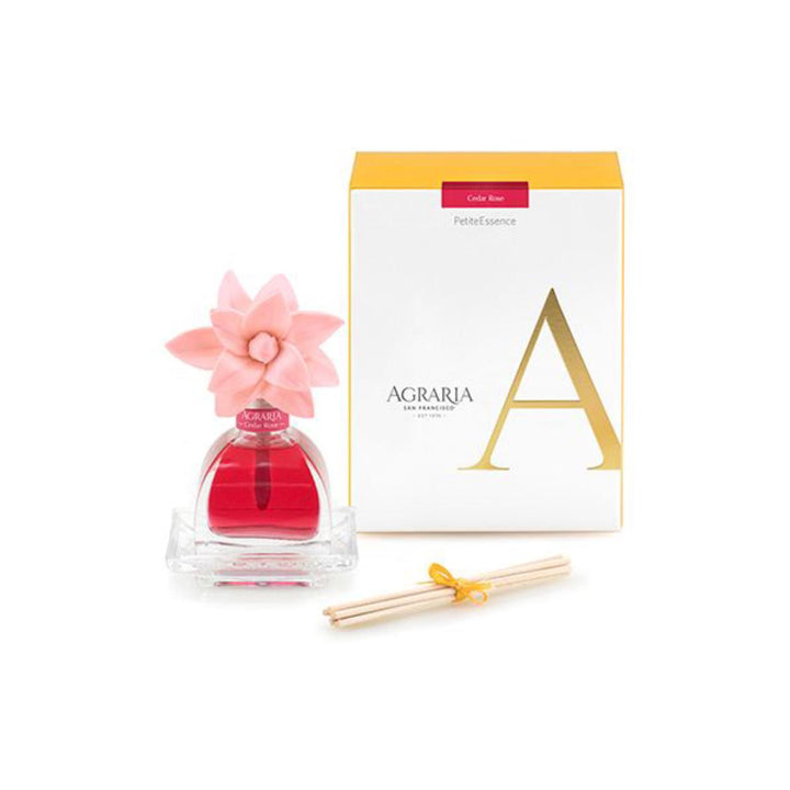Pink scented oil in small glass jar and pink flower to disperse scent. Bamboo reeds and yellow gift box included. 